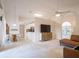 Open-concept living room with dining area, modern furniture, and bright natural light at 1672 Canoe Creek Rd, Oviedo, FL 32766