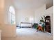 Bright, open living room with lots of light, two chairs, and an accent wall with decor at 1672 Canoe Creek Rd, Oviedo, FL 32766
