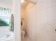 Clean, private toilet room adjoining bathroom with a window at 1672 Canoe Creek Rd, Oviedo, FL 32766