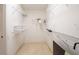 Large walk-in closet with wire shelving on each wall, providing ample storage solutions for clothing and accessories at 1672 Canoe Creek Rd, Oviedo, FL 32766
