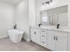 Modern bathroom featuring double sink vanity, freestanding tub, and large mirror with modern lighting at 178 Marion Oaks Ln, Ocala, FL 34473