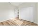 Bedroom with hardwood flooring, double door closet, and white trim with natural light at 178 Marion Oaks Ln, Ocala, FL 34473
