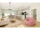 Modern open-concept space with a cozy living room, dining area, and a kitchen island at 178 Marion Oaks Ln, Ocala, FL 34473