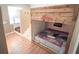 Playful ' room featuring custom-built bunk beds, hardwood floors, and themed decor, designed for imaginative adventures at 19951 Quinlan St, Orlando, FL 32833