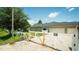 Driveway with a white gate leading to the house at 19951 Quinlan St, Orlando, FL 32833