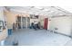 A two car garage with storage space and a door to the outside at 19951 Quinlan St, Orlando, FL 32833
