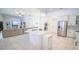 Open floor plan showcasing the kitchen island, stainless steel appliances, and adjacent living room at 19951 Quinlan St, Orlando, FL 32833