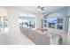 Spacious living room featuring a comfortable sectional sofa and access to a patio with outdoor seating at 19951 Quinlan St, Orlando, FL 32833