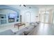 Spacious living room featuring a sectional sofa, built-in shelving, and arched doorways at 19951 Quinlan St, Orlando, FL 32833