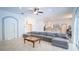 Open-concept living room showcasing a comfortable sectional sofa and seamless flow to the kitchen at 19951 Quinlan St, Orlando, FL 32833