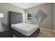 Cozy bedroom featuring plush carpeting, ample natural light, and a decorative statement wall at 2400 Addison Creek Dr, Kissimmee, FL 34758
