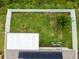 Aerial of fenced backyard and solar panels on the home's roof offering private outdoor space and green energy at 2409 Martins Run, Tavares, FL 32778