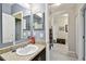 Bathroom featuring a cultured marble vanity and a view into the hallway at 2409 Martins Run, Tavares, FL 32778