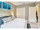 Bright bedroom with double door closets and neutral walls at 2409 Martins Run, Tavares, FL 32778
