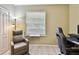 Bedroom with a recliner and a large window at 2409 Martins Run, Tavares, FL 32778