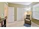 Bedroom with a comfortable chair and a built in closet at 2409 Martins Run, Tavares, FL 32778