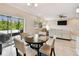 Open dining area with sliding glass doors to the outdoor patio at 2409 Martins Run, Tavares, FL 32778