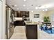 Kitchen featuring stainless steel appliances, granite countertops, and wood cabinetry at 2409 Martins Run, Tavares, FL 32778