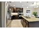 Kitchen featuring stainless steel appliances, granite countertops, and a breakfast bar at 2409 Martins Run, Tavares, FL 32778