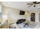 Comfortable living room featuring a ceiling fan, a plush sofa set, and a TV at 2409 Martins Run, Tavares, FL 32778