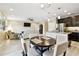 Inviting living space with a view of the kitchen and adjacent dining area at 2409 Martins Run, Tavares, FL 32778