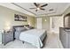 Calm and well-lit main bedroom with a ceiling fan and neutral décor at 2409 Martins Run, Tavares, FL 32778