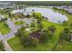 Aerial view of the community playground, lake with fountain, swimming pool, and clubhouse at 2777 Monticello Way, Kissimmee, FL 34741