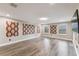 Spacious bonus room with laminate floors, recessed lighting, and multiple windows for natural light at 2777 Monticello Way, Kissimmee, FL 34741