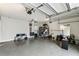 Spacious two-car garage featuring ample storage space and bright overhead lighting at 2777 Monticello Way, Kissimmee, FL 34741