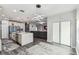 Open-concept living room showcasing a plush sectional sofa, contemporary lighting, and stylish flooring at 2777 Monticello Way, Kissimmee, FL 34741