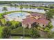 Beautiful community pool with lounge chairs and lake views, perfect for relaxation at 2777 Monticello Way, Kissimmee, FL 34741