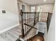 Staircase with wood steps, metal railings, and neutral wall paint at 2777 Monticello Way, Kissimmee, FL 34741