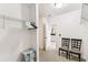 Spacious walk-in closet with shelving, open doorway, and chair at 2777 Monticello Way, Kissimmee, FL 34741
