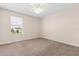 Bedroom with neutral walls, carpet flooring, and a window allowing natural light at 3578 Cortland Dr, Davenport, FL 33837