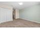 Bedroom featuring carpet flooring, neutral-colored walls, and a closet at 3578 Cortland Dr, Davenport, FL 33837