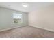 Bedroom featuring carpet flooring, neutral-colored walls, and a window at 3578 Cortland Dr, Davenport, FL 33837