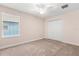 Bedroom featuring a window, closet doors, and neutral-colored carpet flooring at 3578 Cortland Dr, Davenport, FL 33837