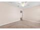 Bedroom with carpet flooring, neutral walls, and an open doorway at 3578 Cortland Dr, Davenport, FL 33837