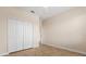 Guest bedroom features neutral walls, tiled floors, a ceiling fan, and closet space at 3578 Cortland Dr, Davenport, FL 33837