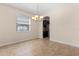 Dining room with tiled flooring, neutral walls, and a view of the kitchen at 3578 Cortland Dr, Davenport, FL 33837