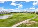 Breathtaking aerial view of the golf course, showcasing lush greenery, water and beautiful landscaping at 3578 Cortland Dr, Davenport, FL 33837