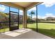 Enjoy this screened lanai and relaxing views of the lawn, garden and pond at 3578 Cortland Dr, Davenport, FL 33837