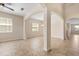 Spacious living room featuring tile floors, neutral walls, and elegant archways at 3578 Cortland Dr, Davenport, FL 33837