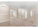 Upstairs loft area with multiple doors leading to bedrooms and bathrooms with carpet at 3578 Cortland Dr, Davenport, FL 33837