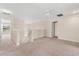 Neutral-toned loft space featuring carpet, stairs, a ceiling fan and natural lighting at 3578 Cortland Dr, Davenport, FL 33837