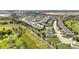 Panoramic aerial of a planned residential community with mature landscaping and scenic nature views at 3744 Quaint Ln, Clermont, FL 34711