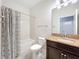 Bathroom featuring a shower-tub combination and a granite vanity countertop at 3744 Quaint Ln, Clermont, FL 34711