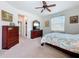 Bedroom with a floral patterned bedspread and ample space at 3744 Quaint Ln, Clermont, FL 34711