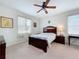 Bedroom with a floral bedspread, natural light, and ceiling fan at 3744 Quaint Ln, Clermont, FL 34711