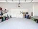 Spacious two car garage with ample space for storage, showcasing its potential for organization at 3744 Quaint Ln, Clermont, FL 34711